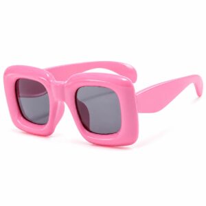 Oversized bubblegum pink square sunglasses with chunky glossy frames and tinted lenses
