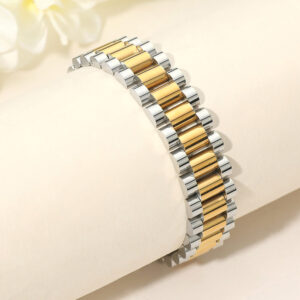 Two tone stainless steel President link bracelet featuring polished gold and silver links and a classic statement jewelry design.